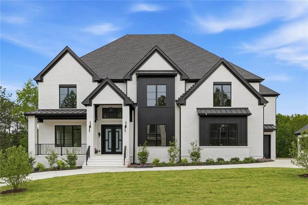 Contemporary home with a white and dark exterior, shown in the supplied Suwanee Preserves listing
