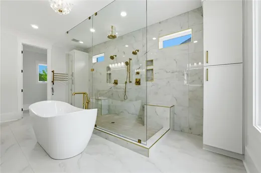 Bathroom with a freestanding tub and glass shower