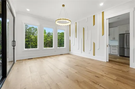 Unfurnished dining space with windows on two sides