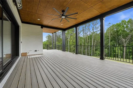 Covered outdoor deck overlooking trees