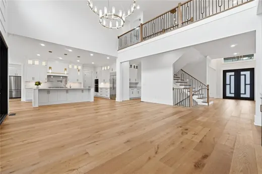 View across an open living space toward the kitchen